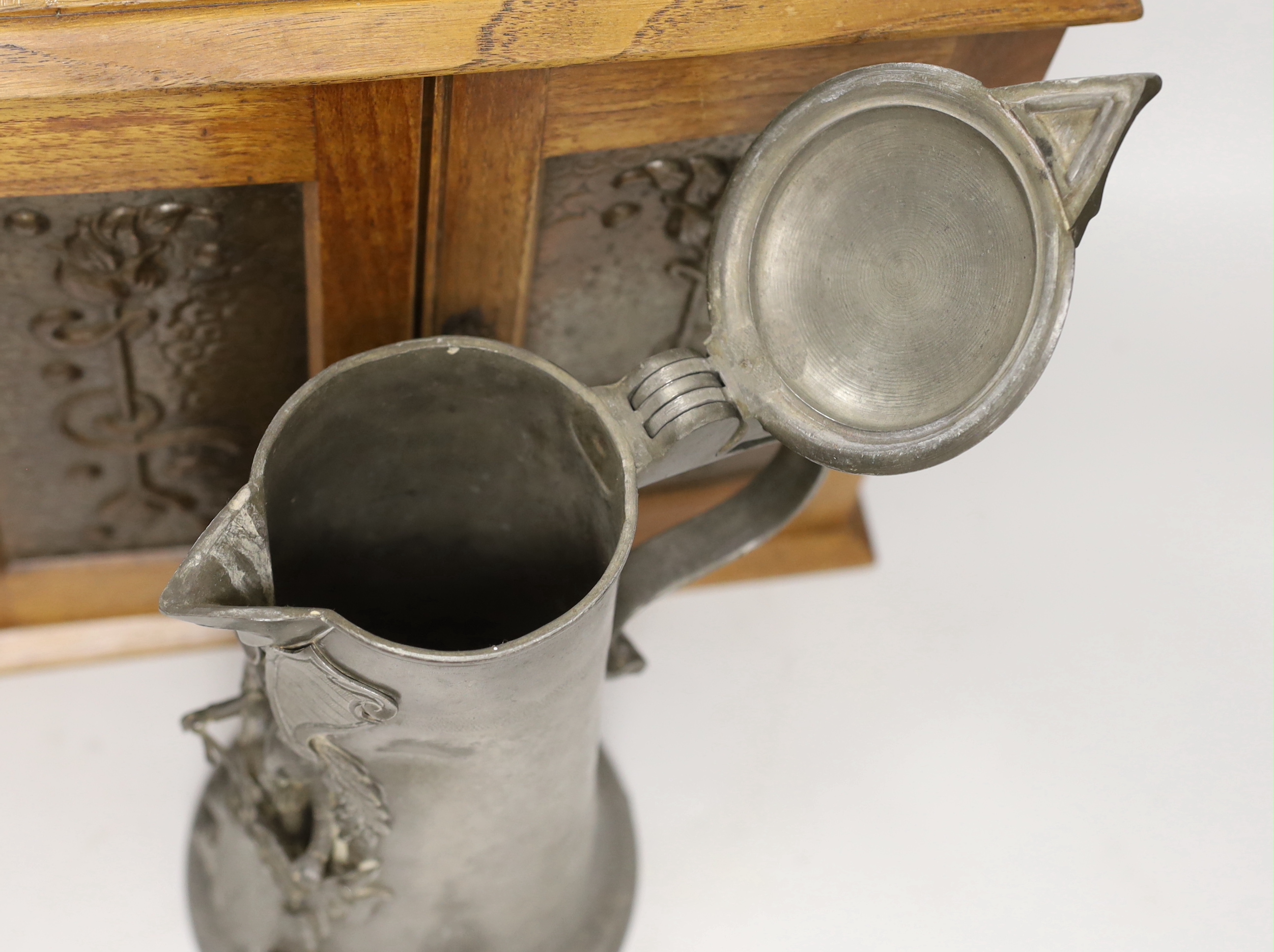 A German pewter commemorative flagon and an Art Nouveau smoker's cabinet